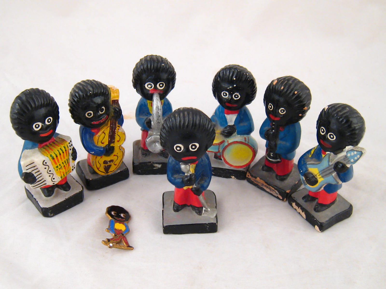 A set of seven Robinsons painted composition Golliwog band figures