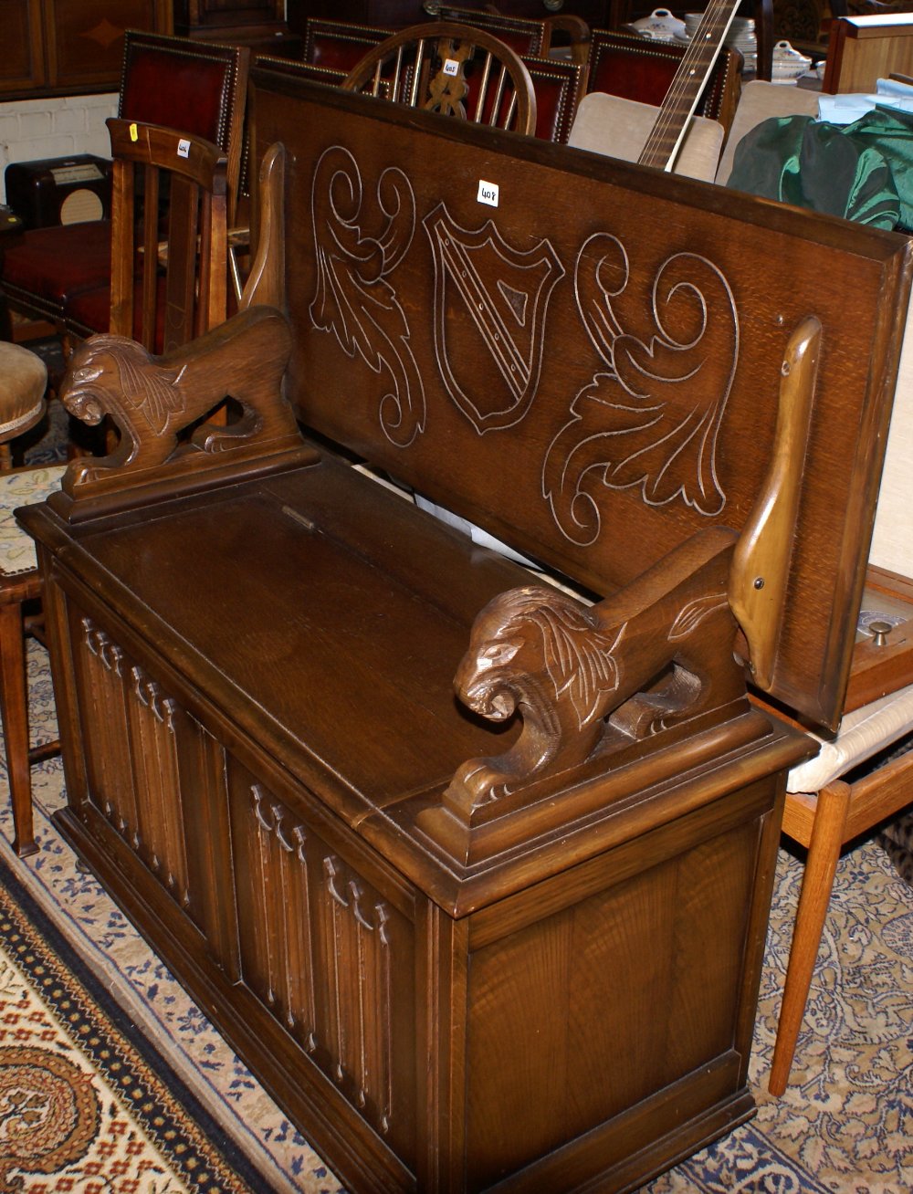 Carved Oak Monks Bench Seat With Lion Arm Rests And Storage Box