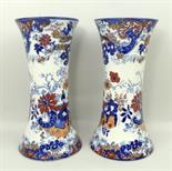 A pair of pottery vases, late 19th century, of waisted form transfer decorated in blue and white and