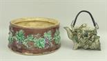 A Wedgwood majolica dish, cover lacking, late 19th century, moulded with vines against a brown