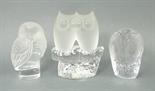 A group of three glass owl paperweights, comprising a Lalique owl, etched Lalique, France, 9cm, a