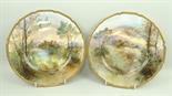 A pair of Royal Doulton porcelain plates painted by J Hughes, signed, with Linlithgow and Ardencapel