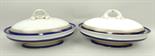 A near pair of Royal Worcester Vitreous vegetable tureens and covers, with cobalt blue banding and
