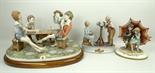 A Capodimonte porcelain figure group, modelled by Cortes of four boys playing cards, 49 by 35cm,