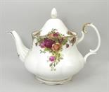 A Royal Albert Old Country Roses part tea service comprising tea pot, cake plate, six tea cups,