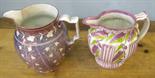 Two pink lustre jugs circa 1800.