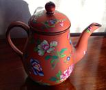 Wedgwood terracotta coffee pot with enamel  peony decoration and a jasperware jug.