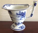 Eighteenth century blue and white helmet shaped cream jug.