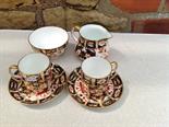 Two Crown Derby coffee cans, milk jug and sugar basin.