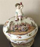 Fine quality Nineteenth century Meissen bowl and cover with cherub handle.