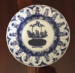 Pair of 18thc Chinese blue and white plates with a  basket of flowers, minor chips to the rim.