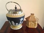 Wedgwood black jasper ware biscuit barrell and a treacle glaze cottage.