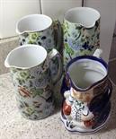 Three graduated late 19th century jugs and an allertons toby jug.