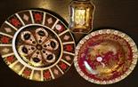 Two Crown Derby plates and a small dish.