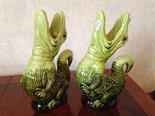 Pair of green majolica crocodile water jugs.