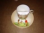 Carlton Ware moustache cup and saucer, depicting golfers.