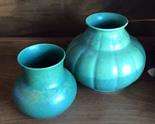 Two Royal Lancaster green pottery vases.
