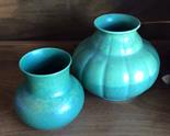 Two Royal Lancaster green pottery vases.