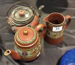 Three piece red ware pottery.