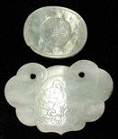 (lot of 2) Chinese jade ornaments, one oval section belt hook incised with a shou medallion;