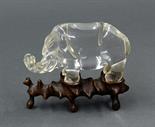 Chinese rock crystal carving, an elephant incised with almond shaped eyes and a gnarled trunk, with