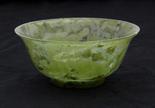 Chinese hardstone bowl, of mottled green hues, the flared sides raised on a short foot, 1.75""h