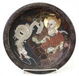 Japanese ceramic plate, textured and featuring a rakan (=arhat) and a white dragon in the center,
