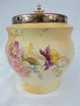 A ceramic biscuit barrel with silver plated fittings, `Carlton ware`. Rd. No. 442141, 7". AF.