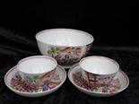 Two 18thC tea bowls, two saucers and a basin, all decorated in Chinese style, the basin bears the