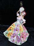 A table lamp in the form of a Spanish dancer in a flower patterned dress, hand painted in Italy, for