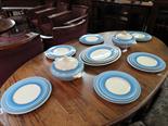 A Clarice Cliff dinner service by Newport Pottery comprising six side plates, six soup plates, six