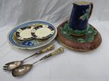 A blue line Spanish Majolica charger marked Recuerdo de Vigo, also an oval Majolica stand, a jug,