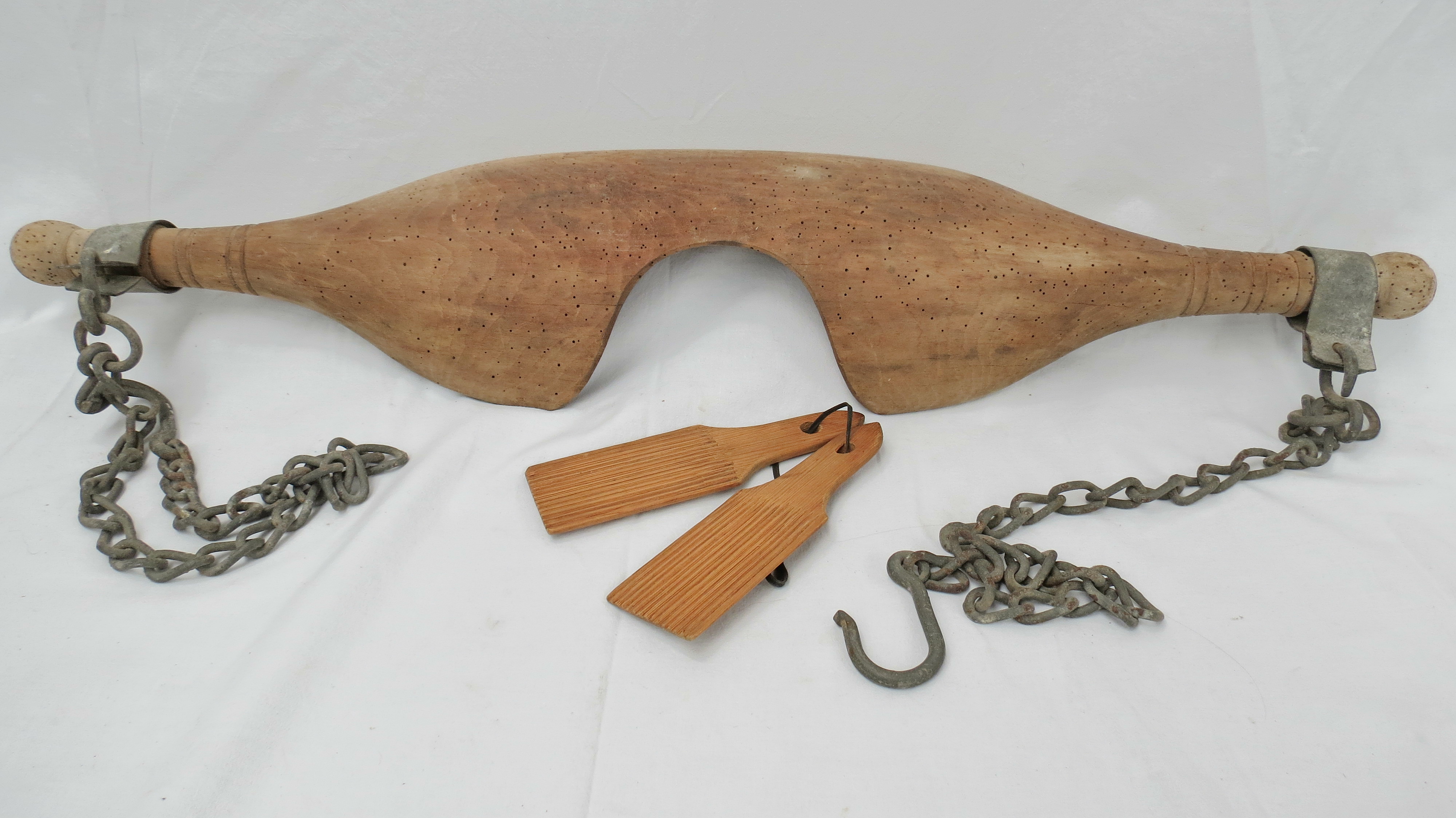 A milkmaids wooden shoulder yoke with chains, also a pair of Scotch