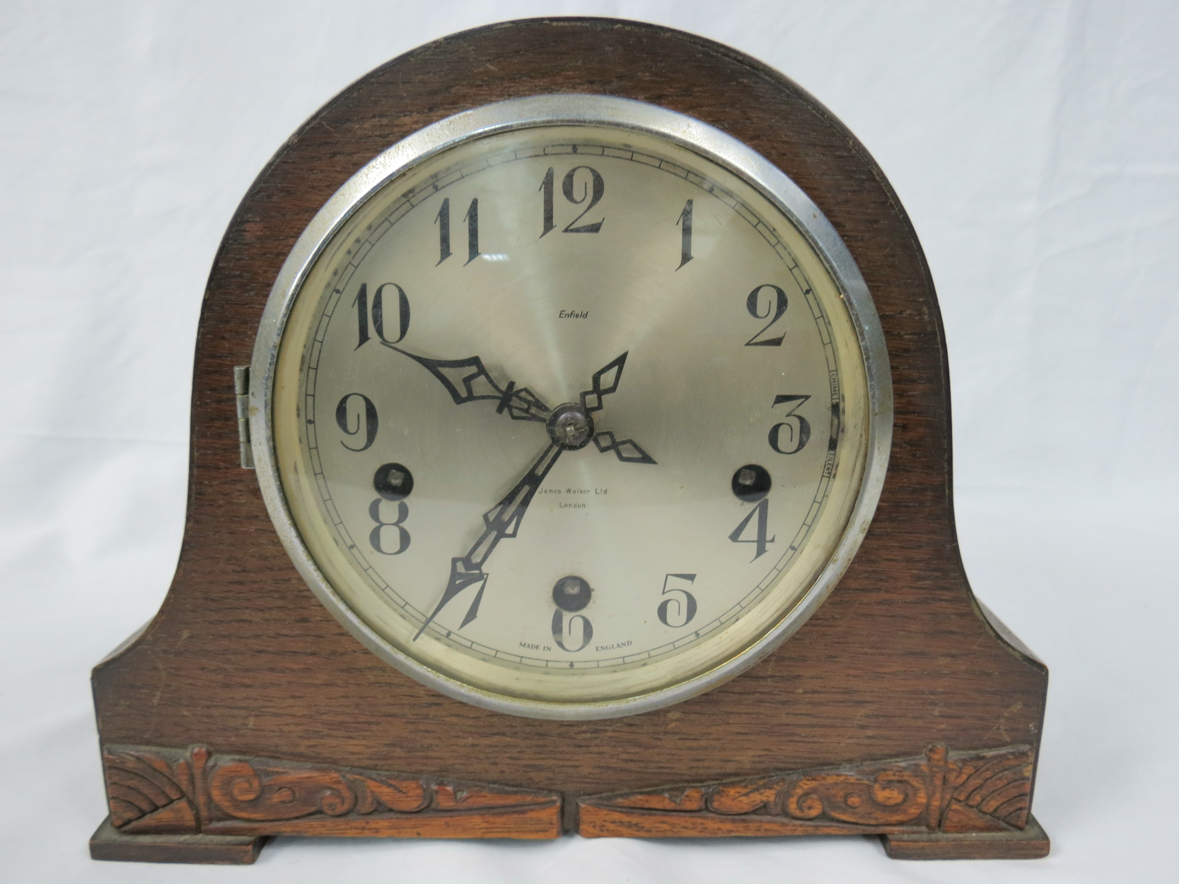 An Enfield 1930s oak cased mantel clock by James Walker Ltd of London