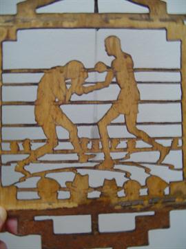 A cedarwood lantern shade with the openwork decoration depicting a boxing match, probably French,