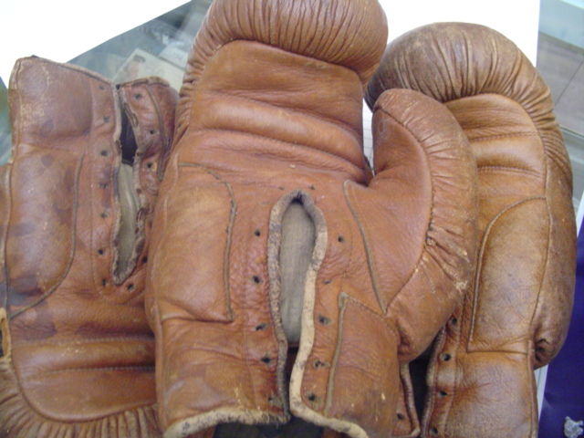 Two pairs of vintage tan leather boxing gloves, maker`s labels for `Stern`, in used condition