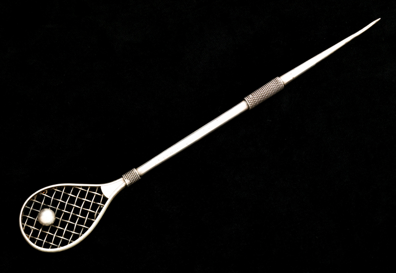An American sterling silver letter opener designed with a tilt-head tennis racquet handle 1890s,