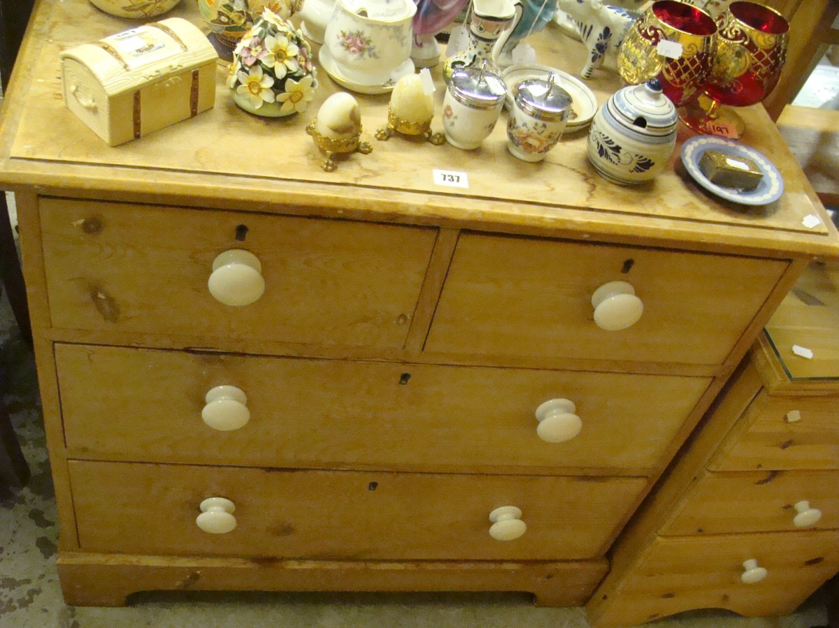 A Victorian Stripped Pine Chest Of Drawers With White Ceramic Knobs