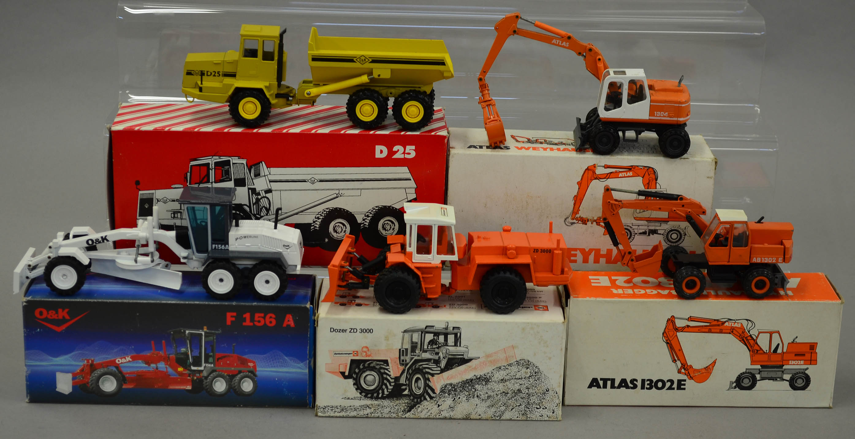 Five diecast model construction vehicles NZG O&K F156A; Conrad Atlas