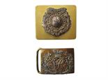 Three Various Royal Marine Belt Buckles consisting Commandant`s waist belt plate.  Gilt