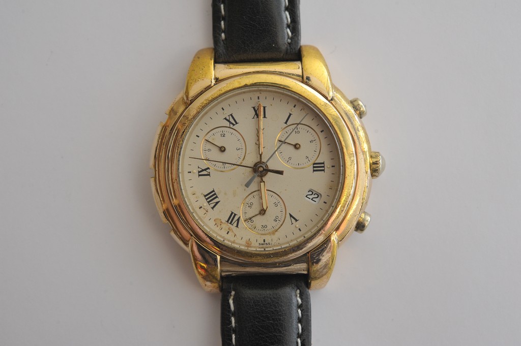 A gold plated Yves Saint Laurent Chronograph men's watch in working order