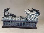 A cast iron novelty mechanical money bank in the form of dolphins swimming - Est £20 - £40