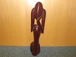 A contemporary carved wooden statue depicting a person 54cm (h)