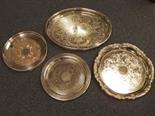 Four good plated silver salvers