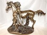 A large bronzed statue depicting a lady and a horse 33cm (h)