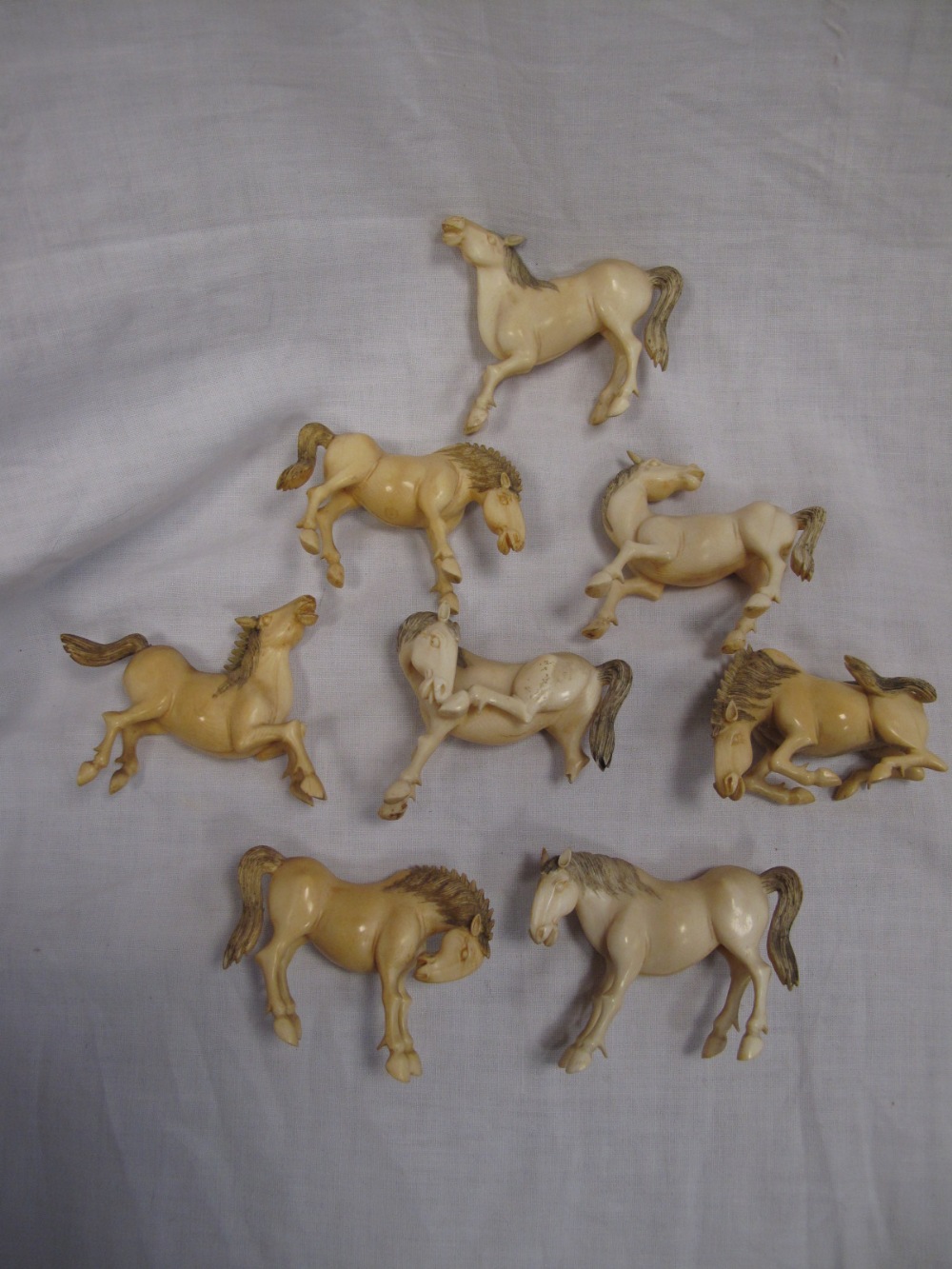Eight 19thC Chinese carved ivory horses "The Eight Horses of Emperor Mu