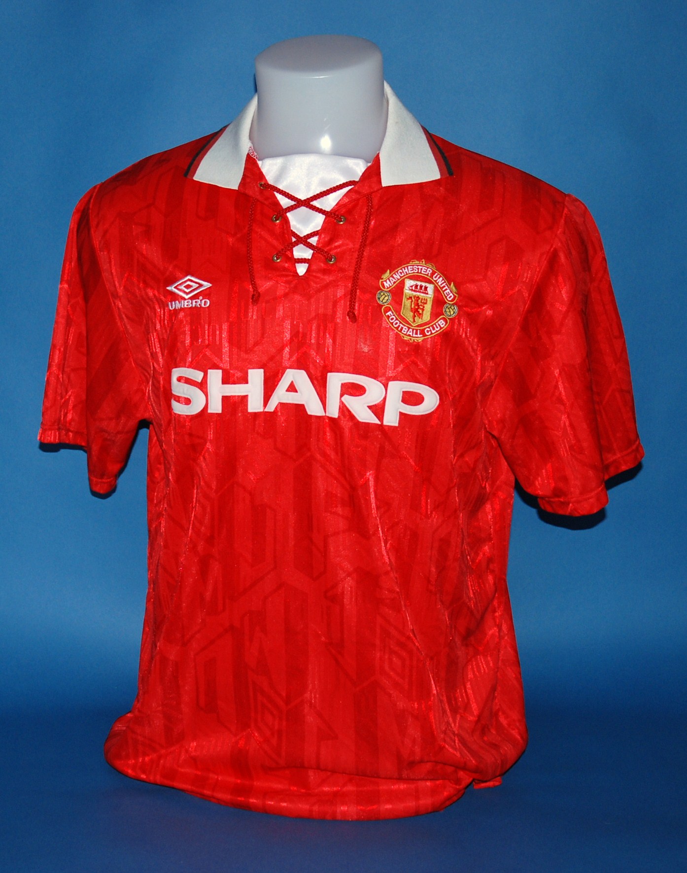 A Red Manchester United Short Sleeved Shirt No 10 With Lace Up Collar And Embroidered Badge Ins