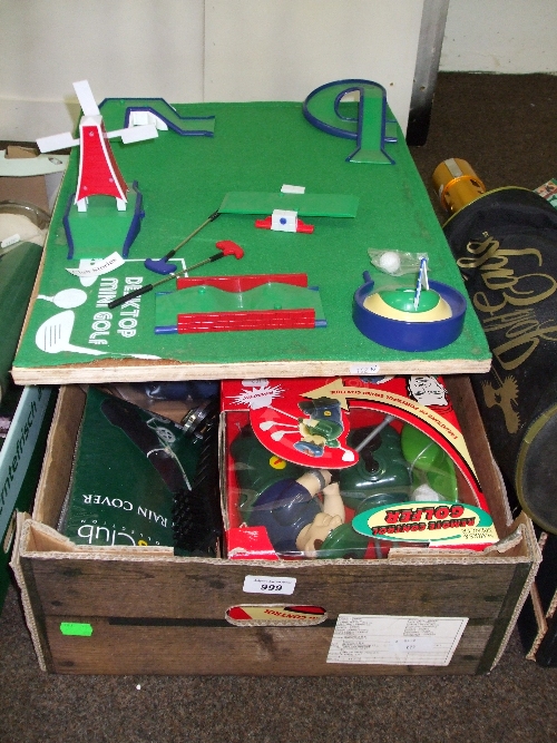 A Box Containing Mostly Golfing Theme Toys Including Desktop Mini