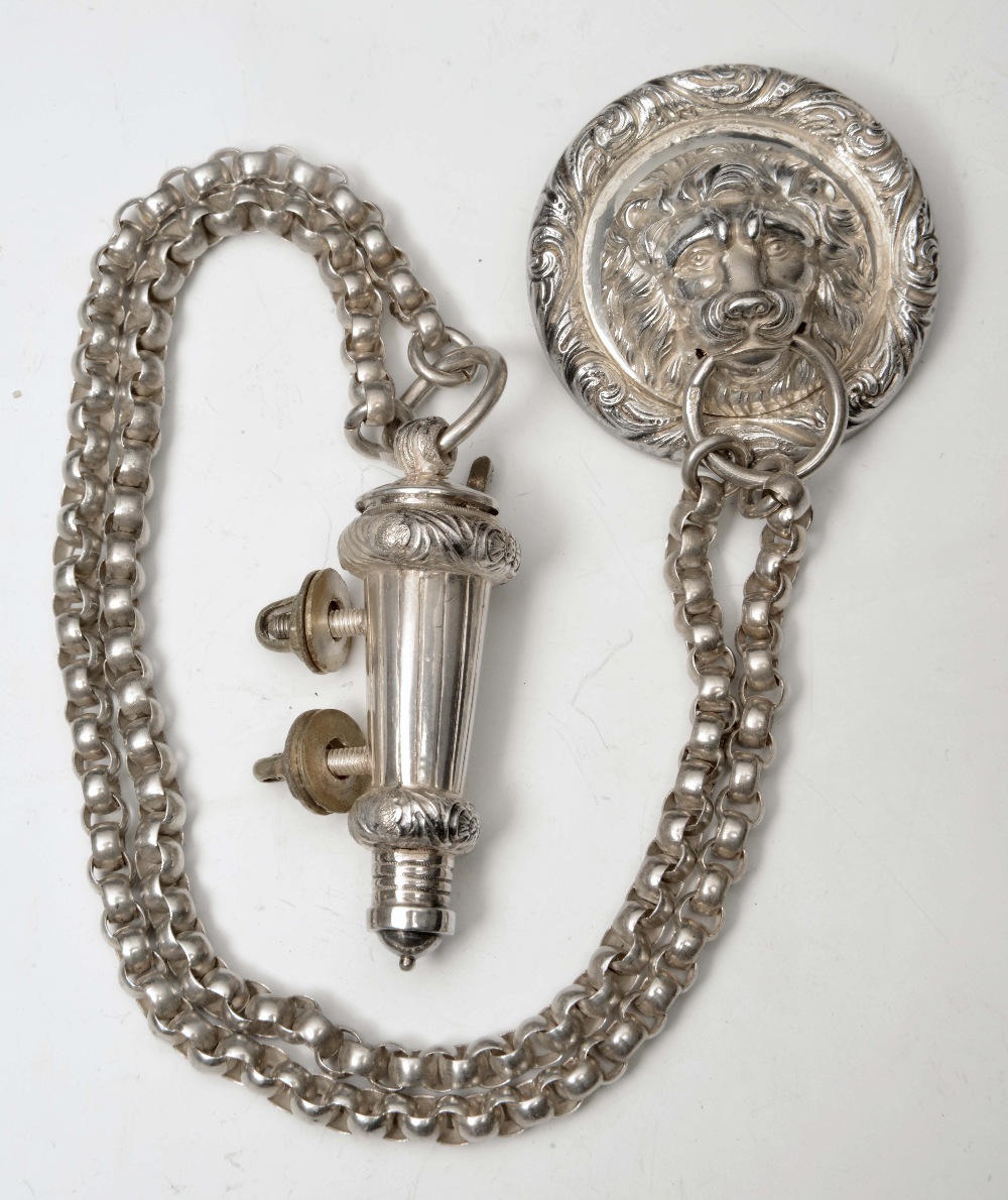 A SILVER `INKERMAN` WHISTLE, CHAIN AND BADGE with lion mask ring