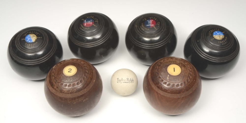 A PAIR OF ANTIQUE WOODEN LAWN BOWLS, four club bowls and a TaylorRolph